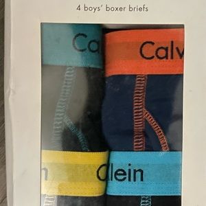 Calvin Klein four pack boys, boxer, briefs size medium (8-10)